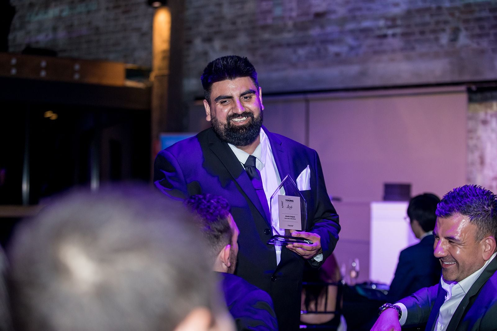 2025 Sydney Young Entrepreneur Awards Gala dinner Winners accepting trophies on stage at the 2025 Sydney Young Entrepreneur Awards
